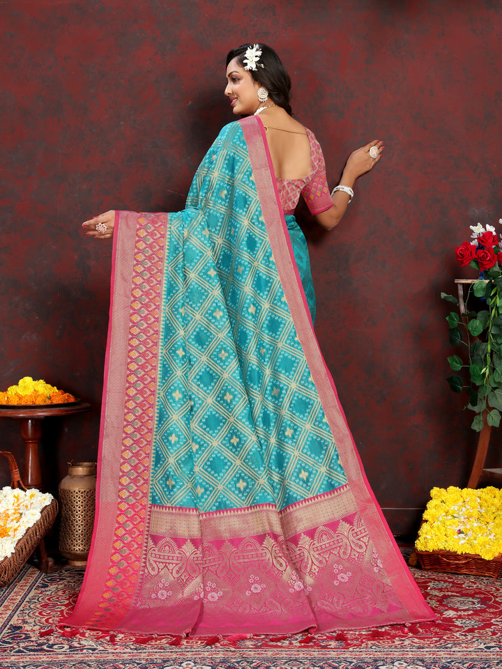 Sophisticated turquoise Organza silk saree with luxurious zari and Meenakari pallu, ideal for cultural gatherings.