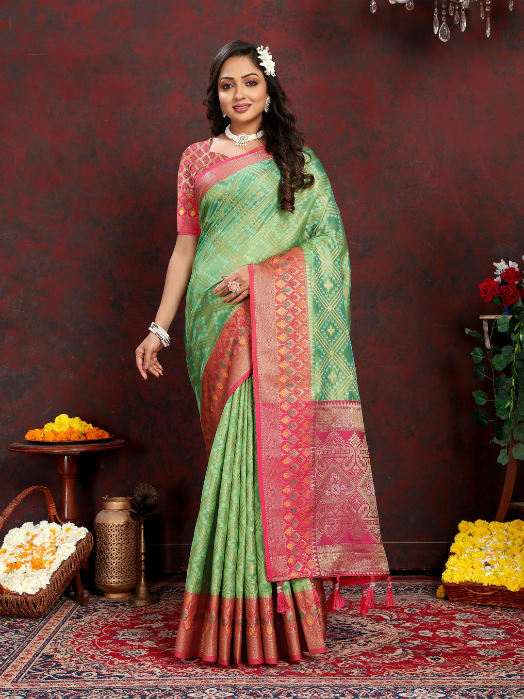 Elegant pista green Organza silk saree with luxurious zari weaving and Meenakari pallu, ideal for celebrations.