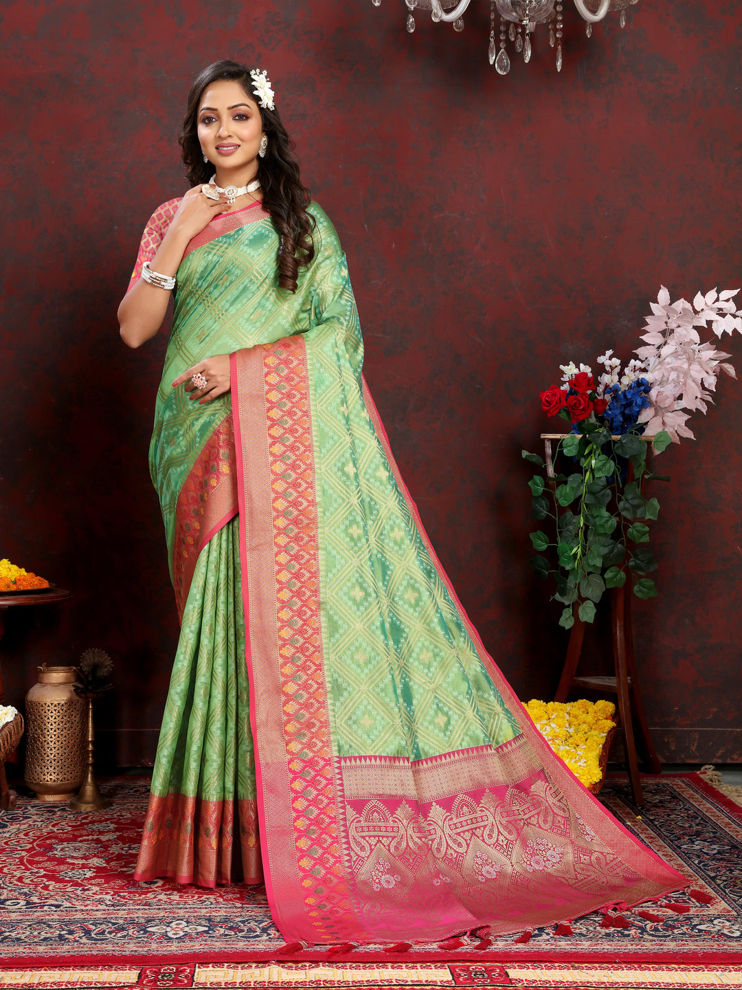 Pista green Organza silk saree with intricate zari detail and Meenakari pallu, perfect for grand gatherings.