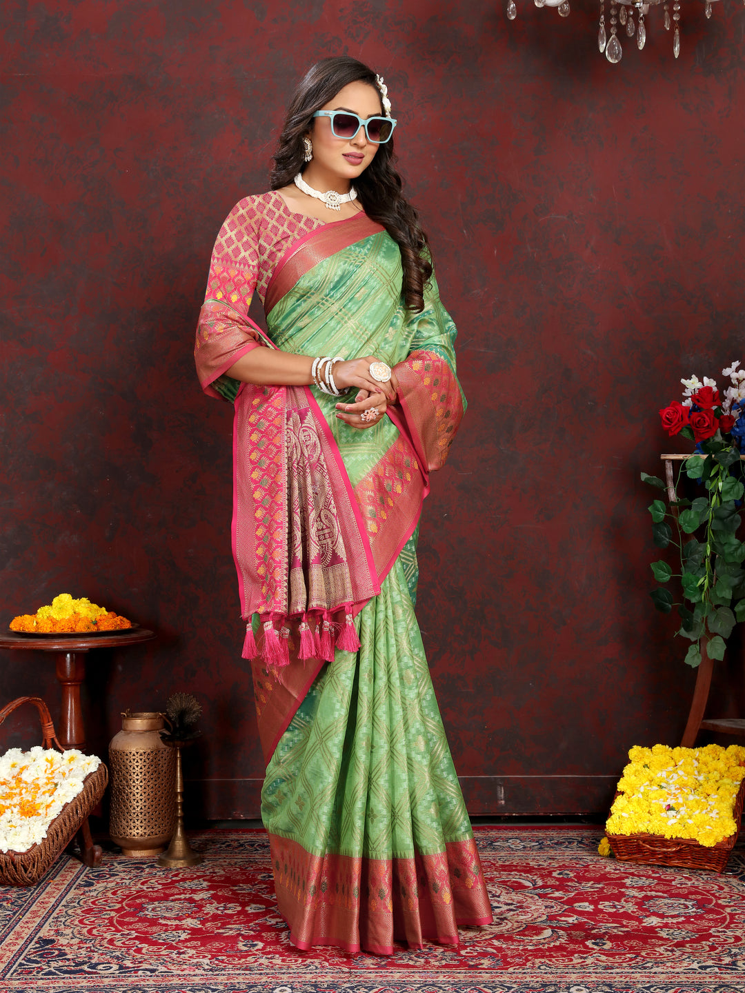 Designer pista green Meenakari Organza silk saree with rich zari and intricate pallu, ideal for weddings.