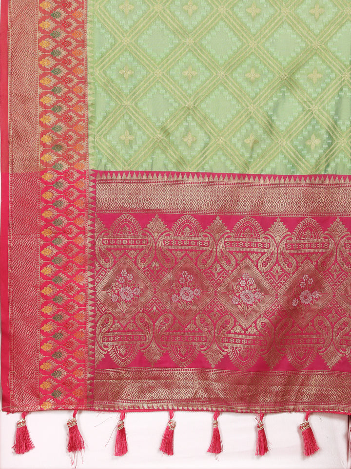 Rich pista green Organza silk saree with exquisite zari weaving and Meenakari artistry, perfect for special occasions.