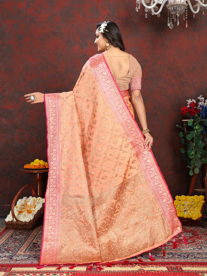 Classic peach Katan silk saree with rich zari pallu and matching silk blouse piece, perfect for festive occasions.