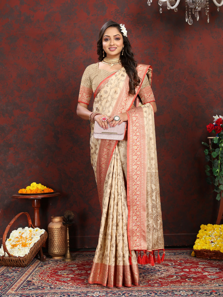 Timeless beige Katan silk saree featuring detailed zari weaving and a tasseled pallu, perfect for special celebrations.