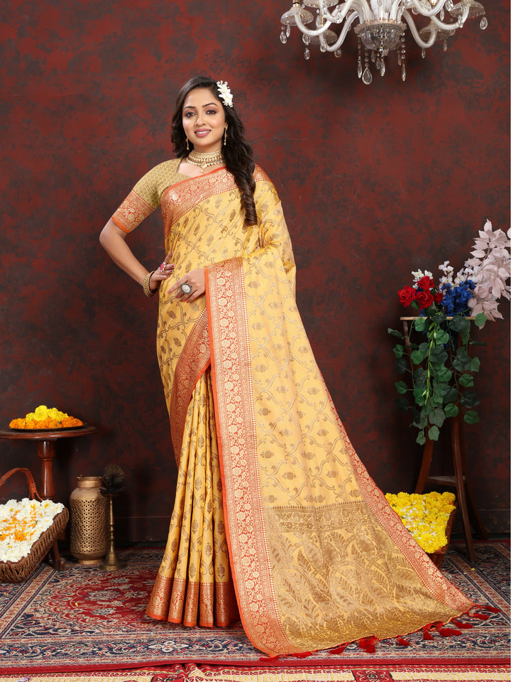 Elegant yellow Katan silk saree with zari border and tassels, perfect for weddings and special occasions.