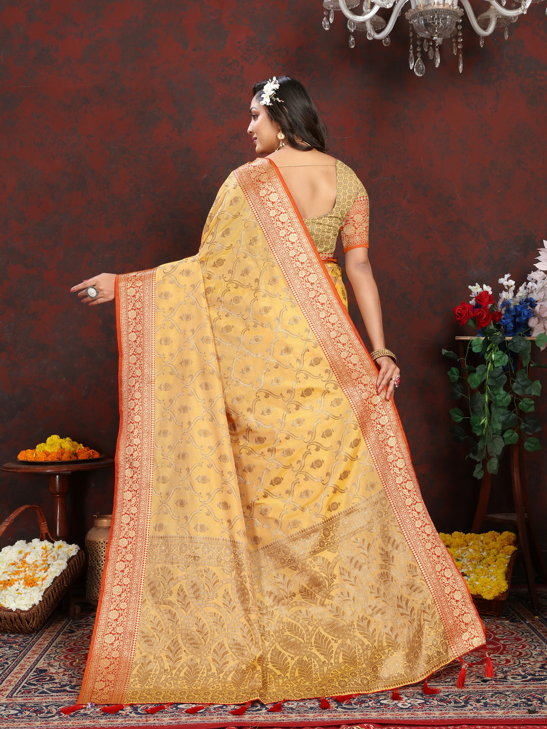 Graceful yellow Katan silk saree with matching blouse piece and beautiful zari details, a must-have for weddings.