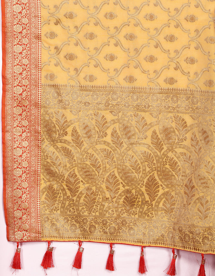 Exquisite yellow Katan silk saree with rich zari work and tassels on the pallu, perfect for festive occasions.