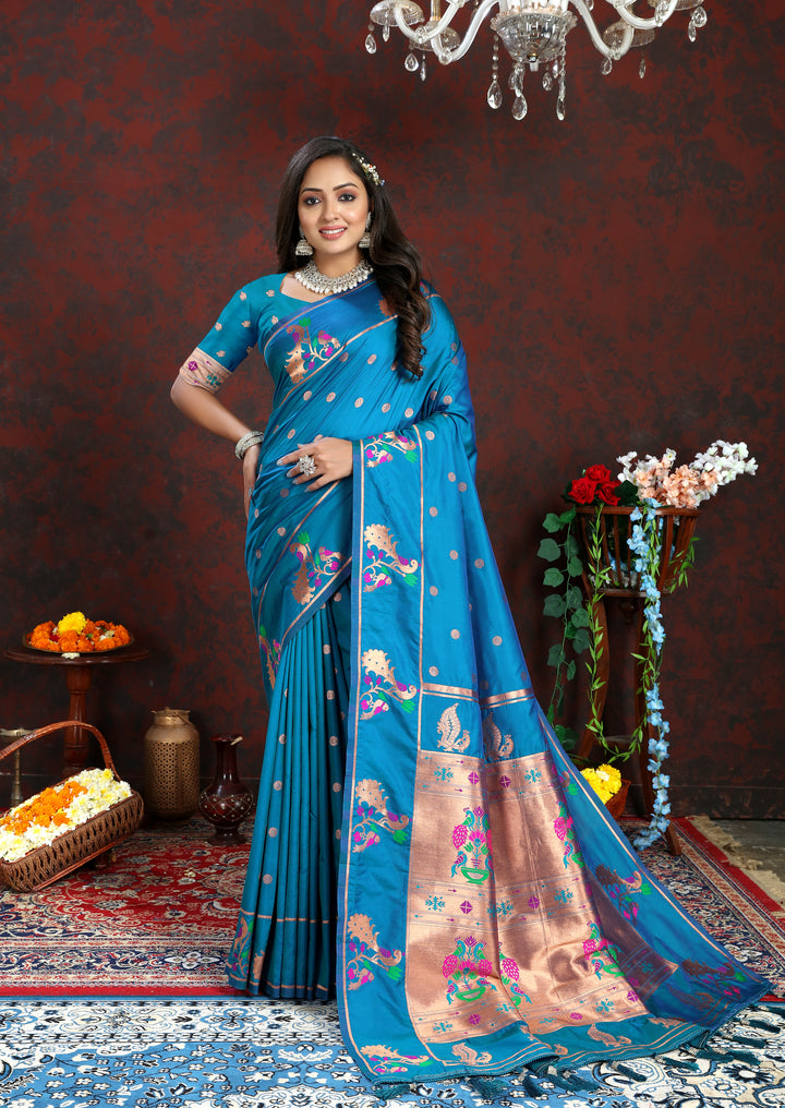 Royal blue Paithani silk saree featuring copper zari motifs and Meenakari border, ideal for traditional celebrations.