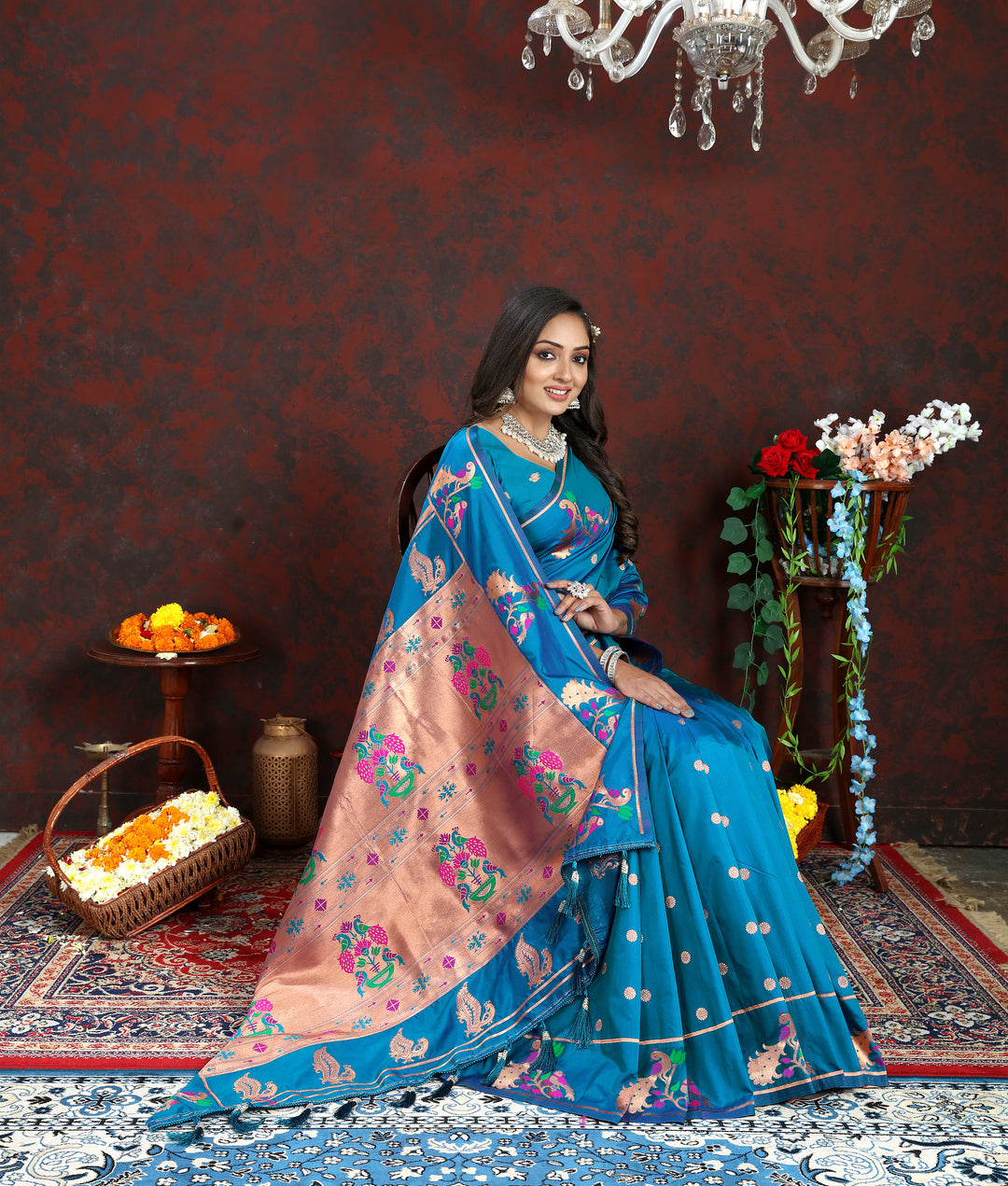 Designer blue Paithani silk saree with copper zari motifs and Meenakari border, perfect for grand events.