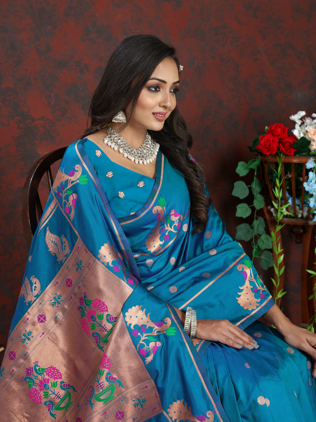 Stunning blue Paithani silk saree with intricate copper zari motifs and Meenakari border, perfect for festive gatherings.