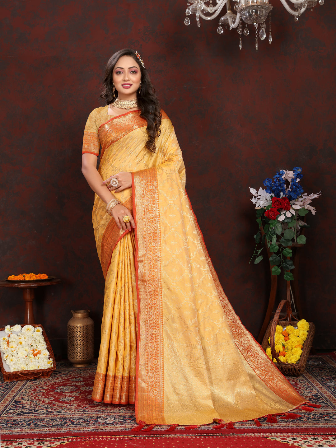 Rich mustard yellow soft Katan silk saree with exquisite zari work, complemented by a matching blouse piece.