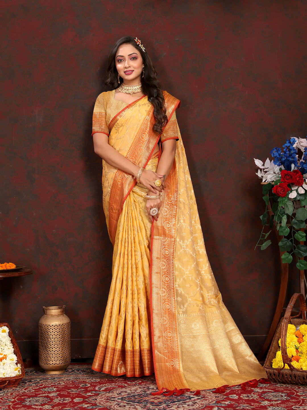 Elegant mustard yellow Katan silk saree featuring detailed zari weaving, ideal for festive occasions.