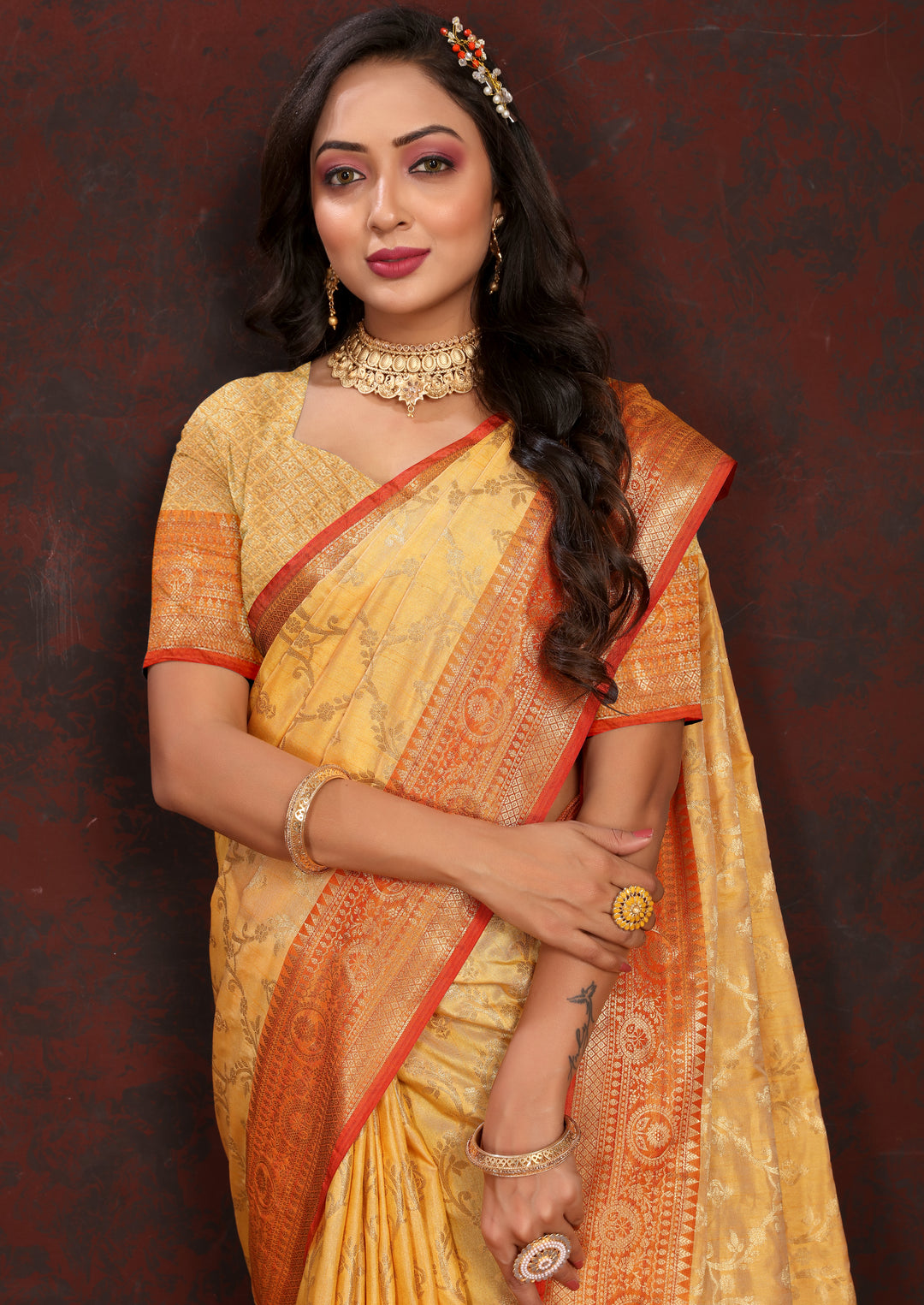 Classic mustard yellow soft Katan silk saree with intricate zari detailing and matching blouse piece.