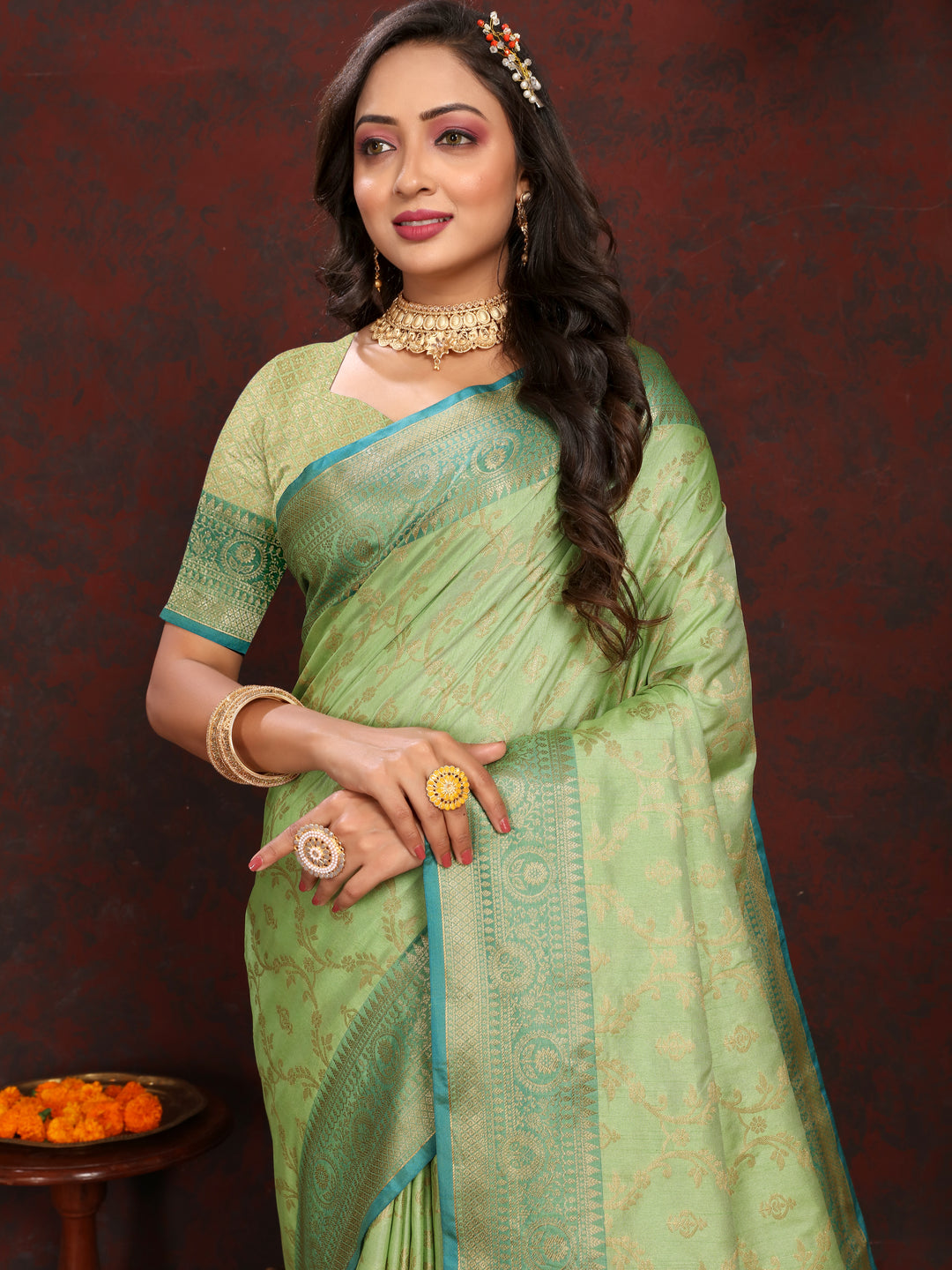 Beautiful pista green Katan silk saree with rich zari weaving, ideal for traditional celebrations.