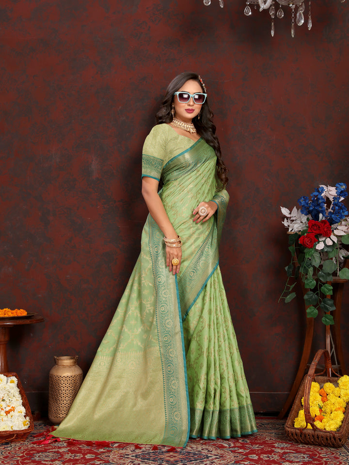 Timeless pista green soft Katan silk saree featuring delicate zari detailing, perfect for elegant gatherings.