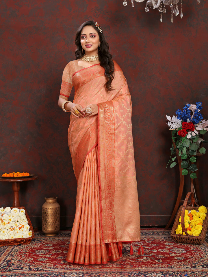 Elegant peach Katan silk saree with intricate zari weaving, perfect for weddings and festive occasions.