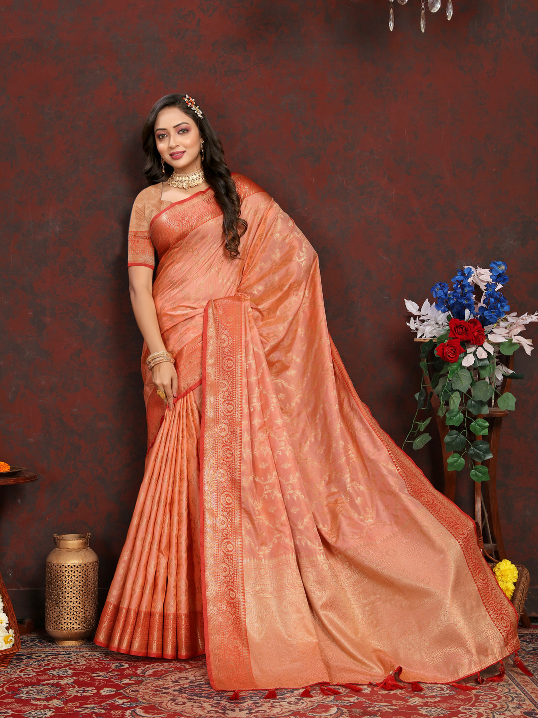 Stunning peach Katan silk saree with intricate golden zari detailing, ideal for special celebrations.