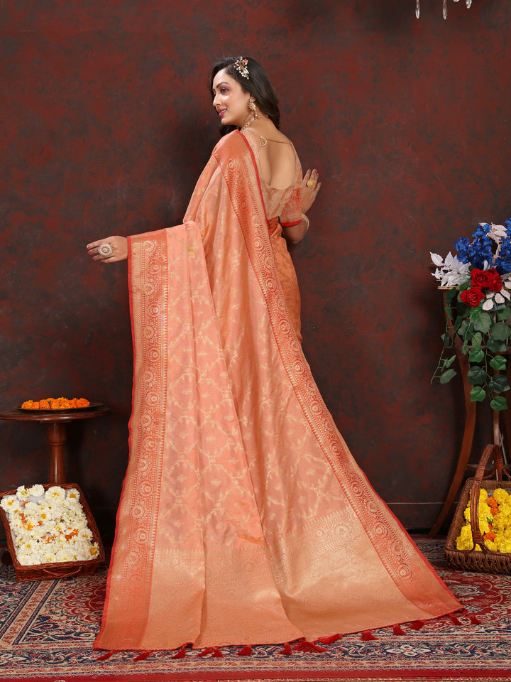 Beautiful peach Katan silk saree with detailed zari work, complete with a matching blouse piece.