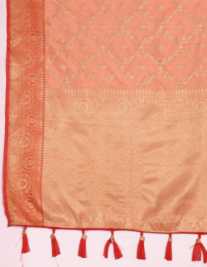 Vibrant peach soft Katan silk saree with delicate zari detailing and matching blouse piece.