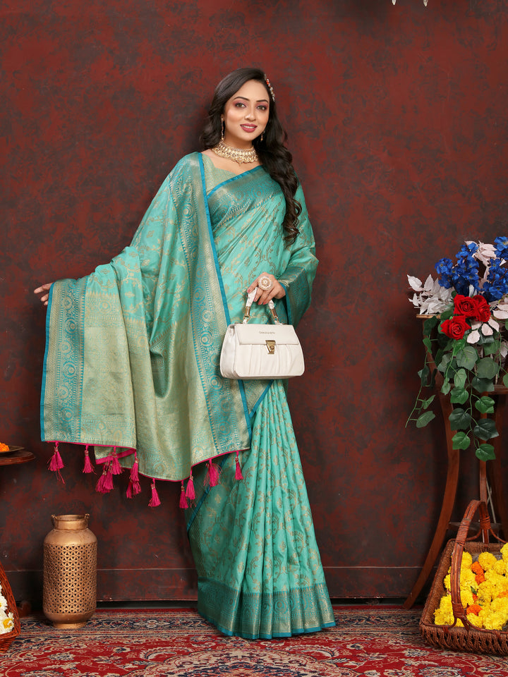 Graceful sea-blue Katan silk saree with delicate zari work, perfect for traditional celebrations.