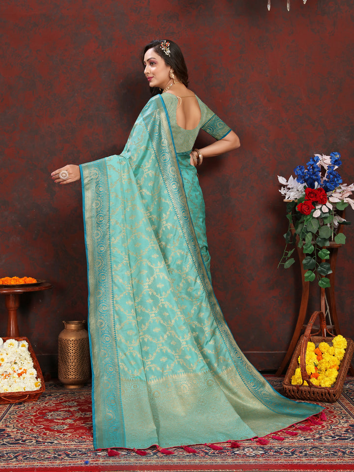 Timeless sea-blue Katan silk saree with intricate zari weaving, ideal for festive occasions.