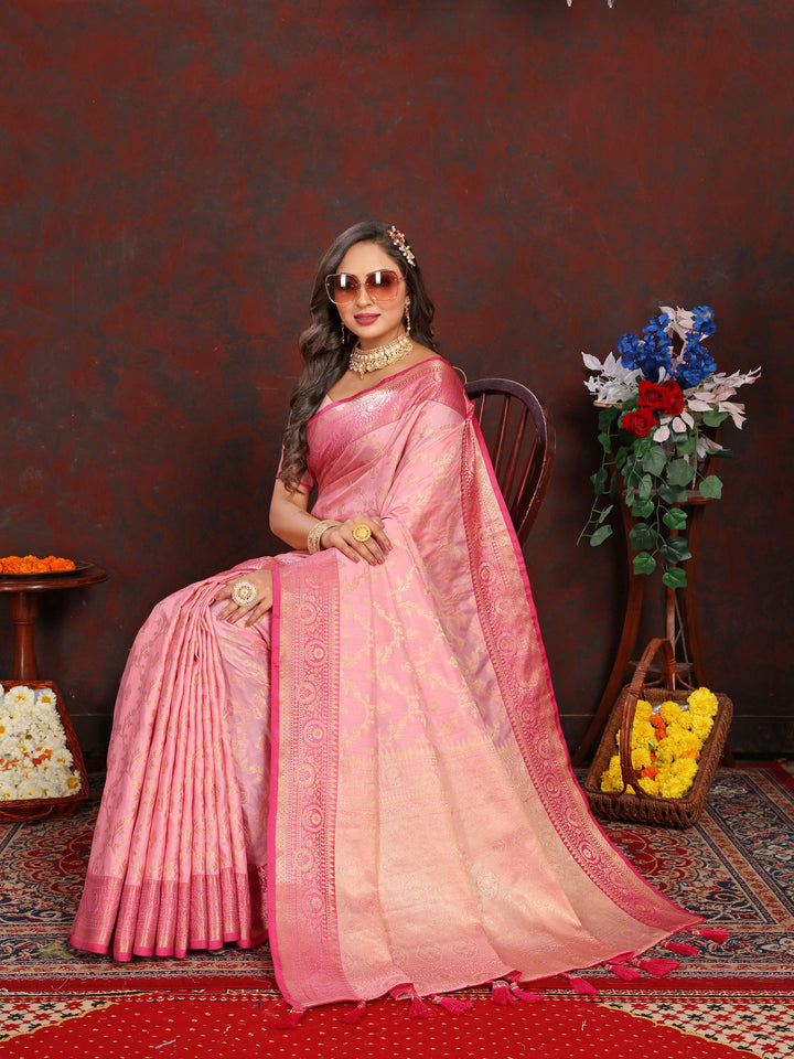 Stunning pink Katan silk saree featuring luxurious zari work, ideal for special occasions.