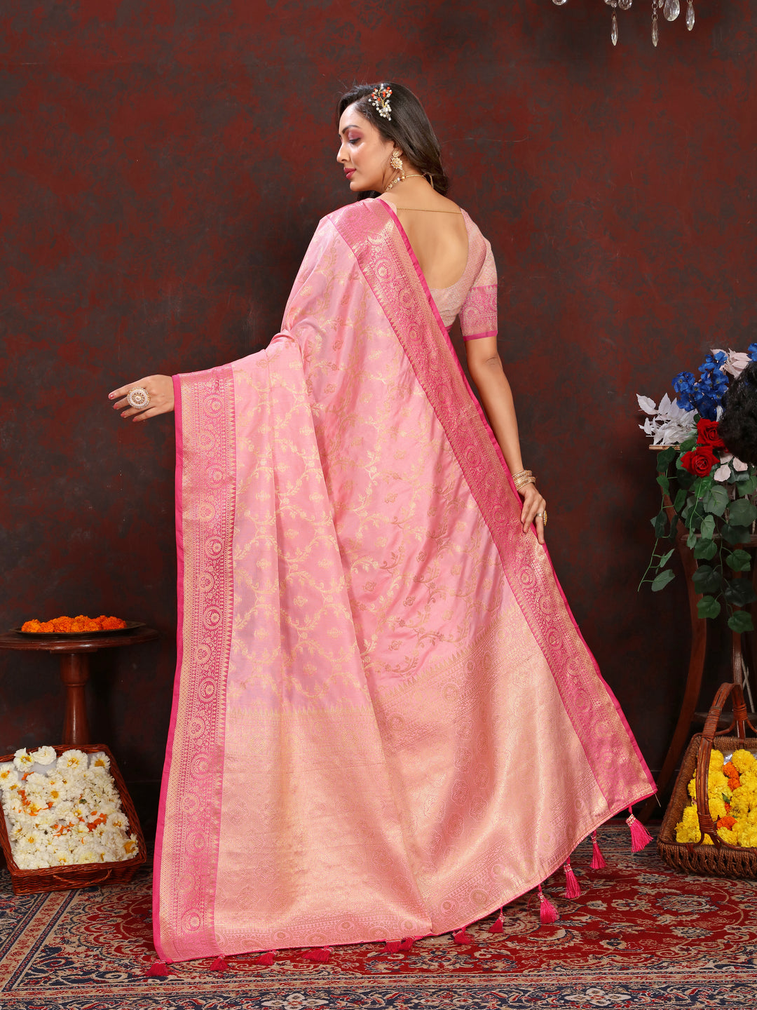 Graceful pink Katan silk saree with exquisite zari weaving, perfect for cultural events and celebrations.