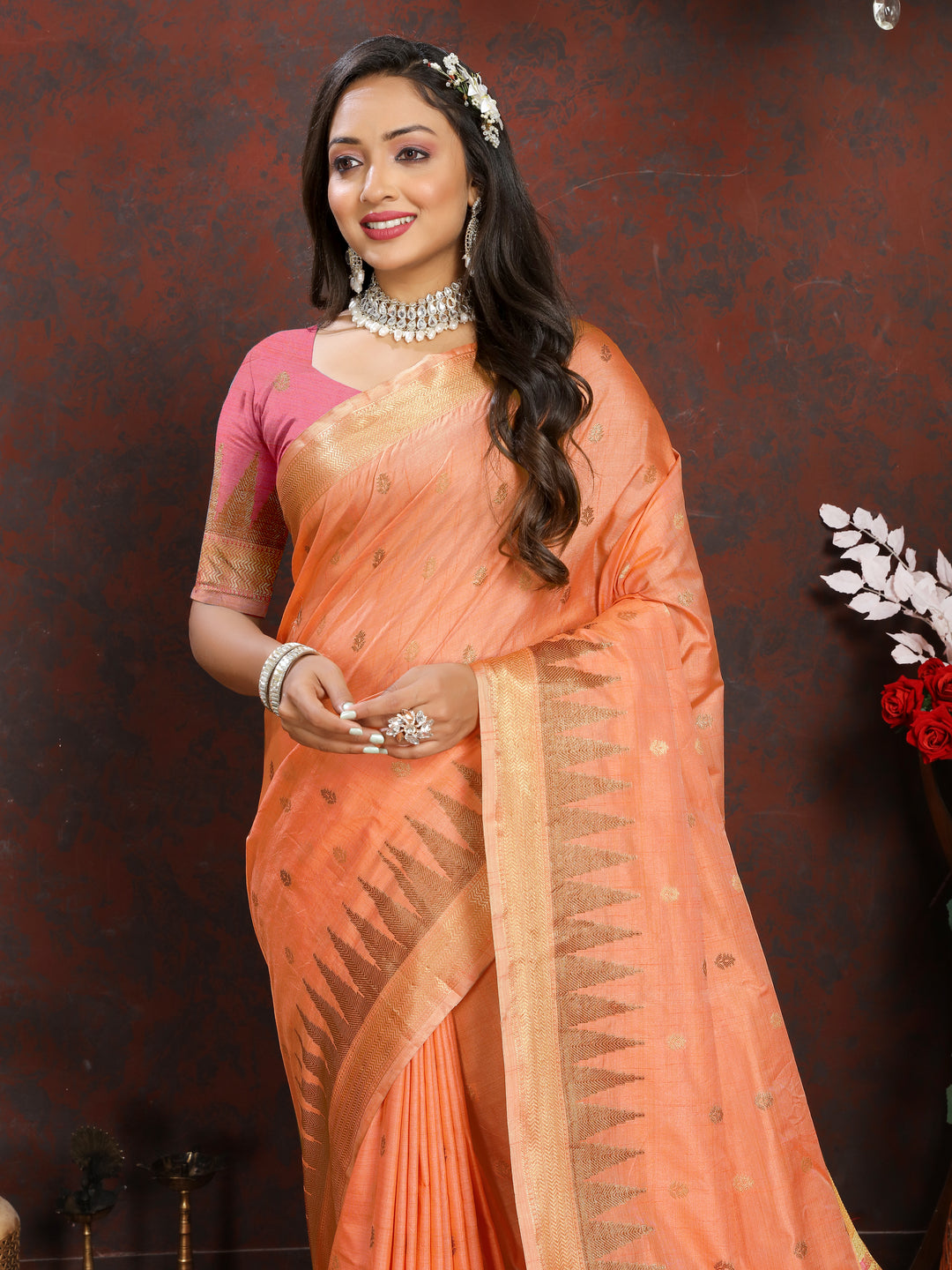 Gorgeous Orange Silk Saree with intricate zari design and designer pallu tassels for bridal wear.