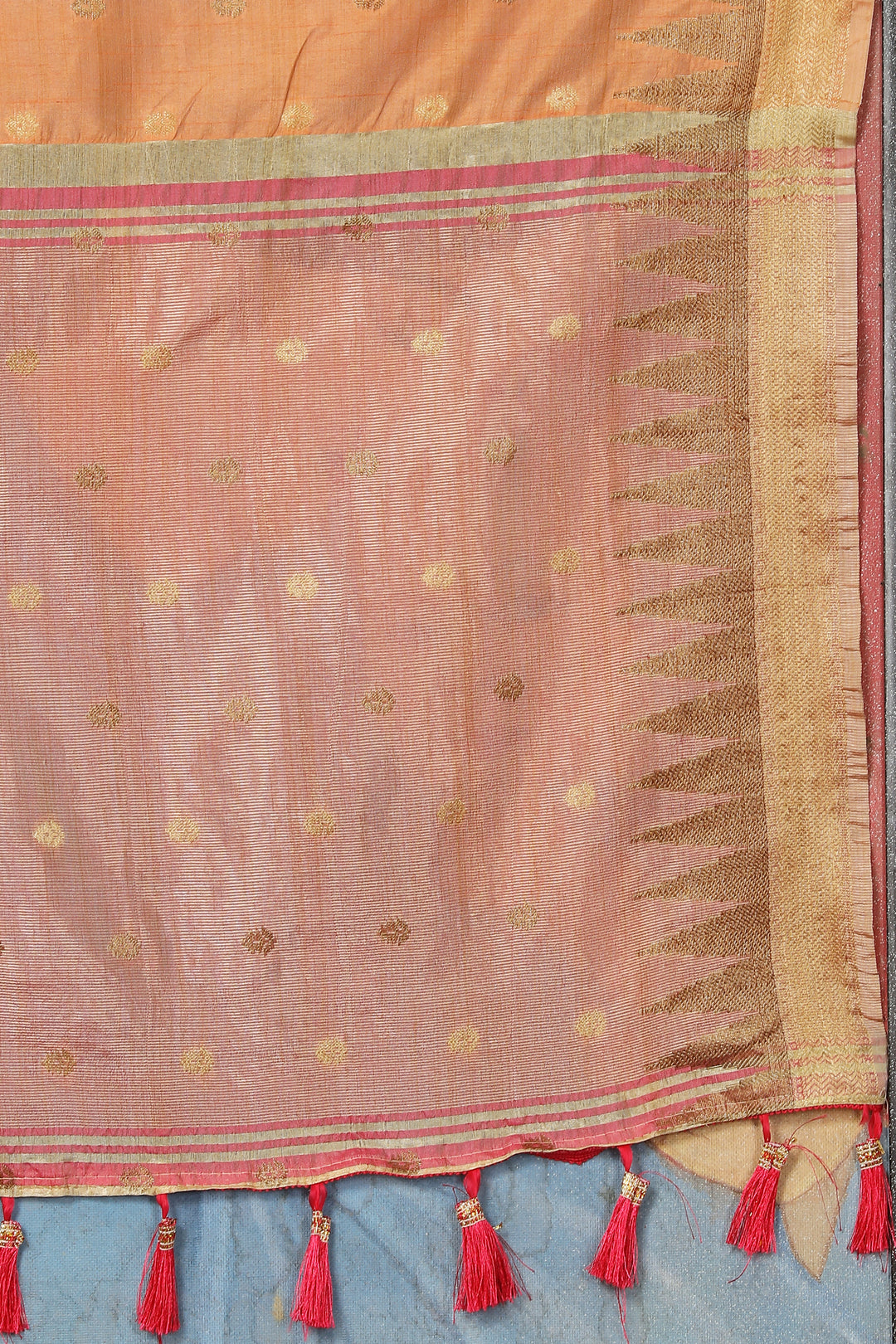 Soft Orange Katan Silk Saree with exquisite zari details and designer pallu tassels for celebrations.