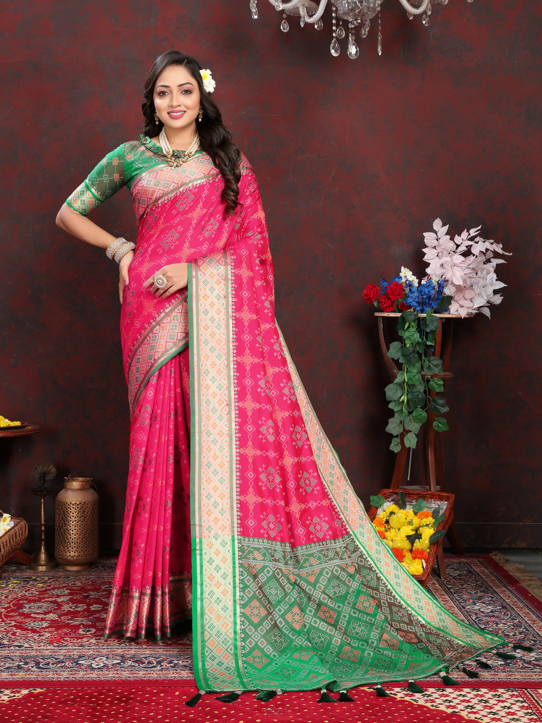 Elegant Coral-Pink Patola Silk Saree with dazzling meenakari work and dreamy pallu style for weddings.