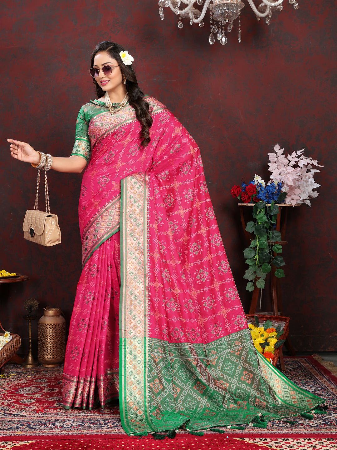 Premium Coral-Pink Patola Silk Saree with exquisite meenakari design and dreamy pallu style for bridal wear.