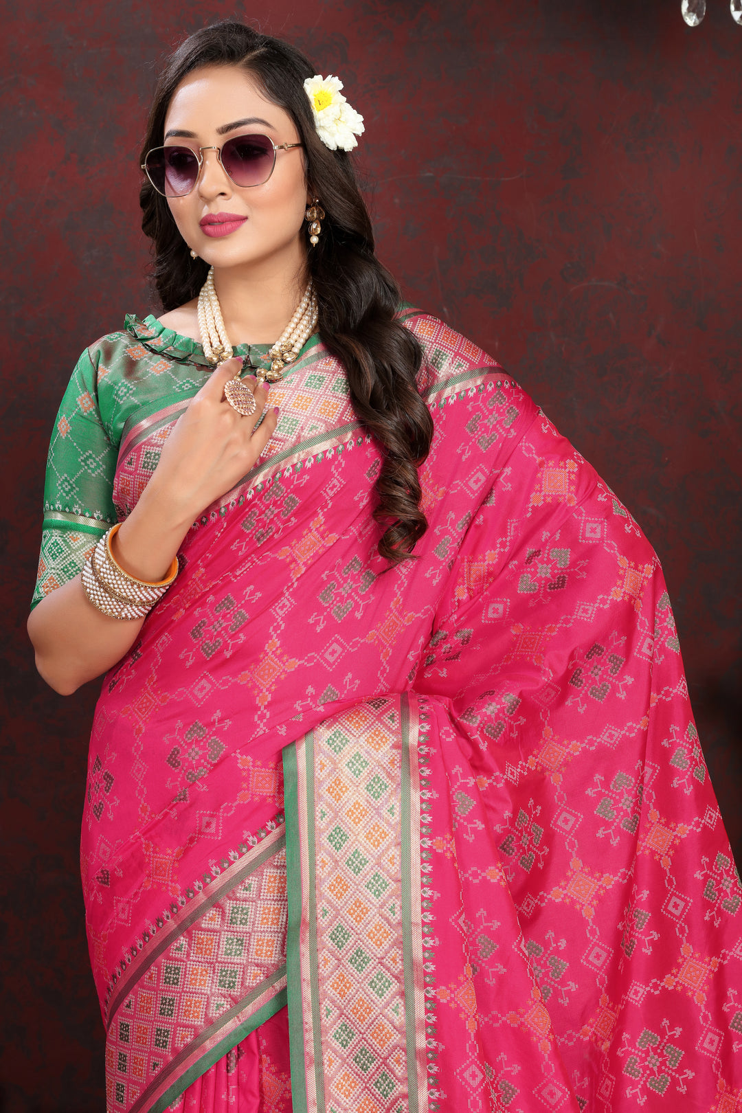 Stunning Coral-Pink Silk Saree with detailed meenakari work and elegant pallu design for traditional occasions.