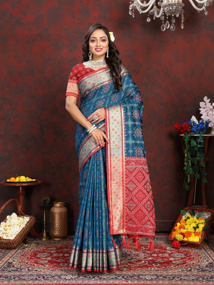 Stunning Teal-Blue Patola Silk Saree with intricate meenakari work and dreamy pallu style for bridal wear.