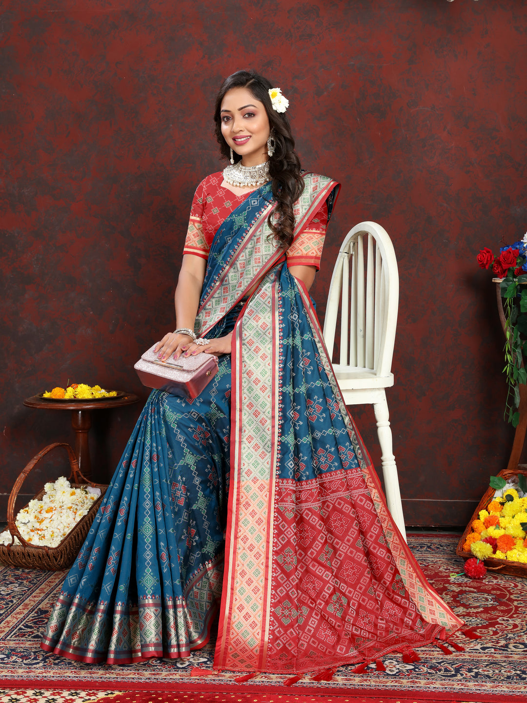 Vibrant Teal-Blue Silk Saree featuring intricate meenakari work and stylish pallu style for special occasions.