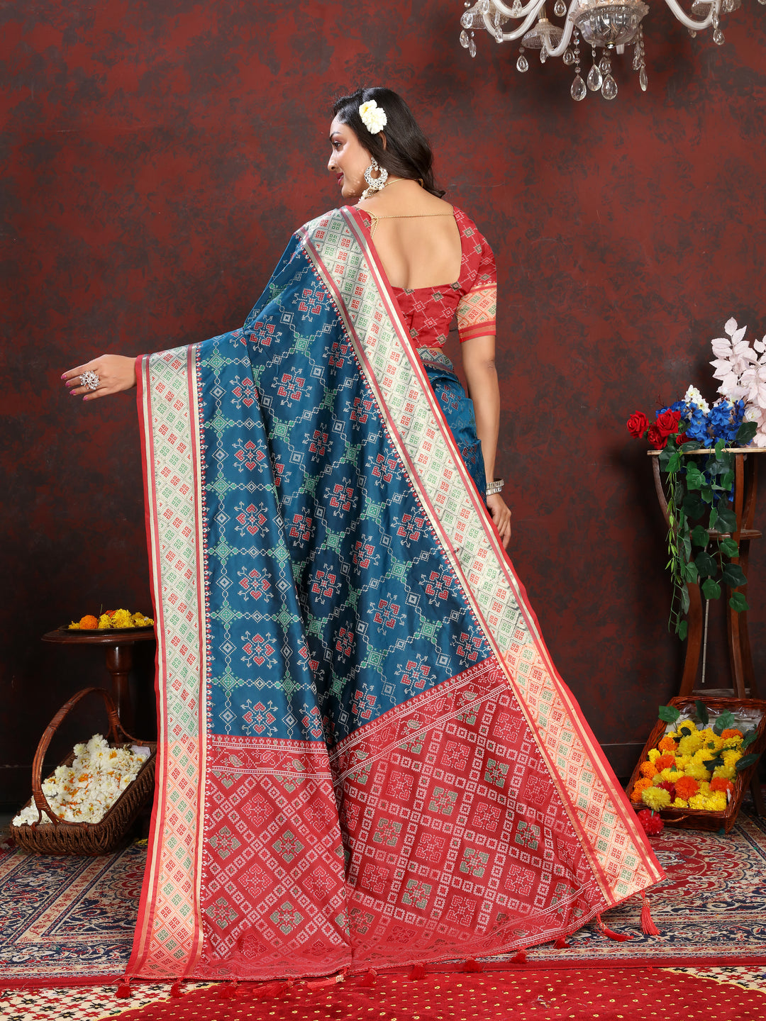 Beautiful Teal-Blue Patola Silk Saree with rich meenakari details and dreamy pallu style for weddings.