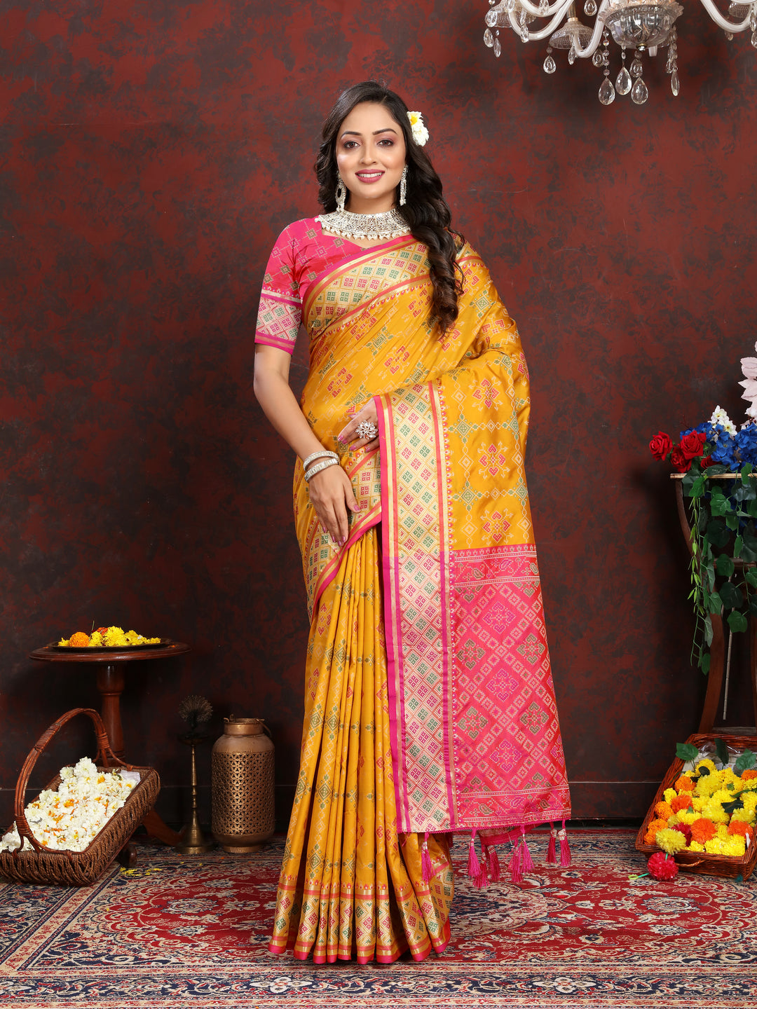 Elegant Yellow Patola Silk Saree with intricate meenakari work and dreamy pallu style for festive occasions.