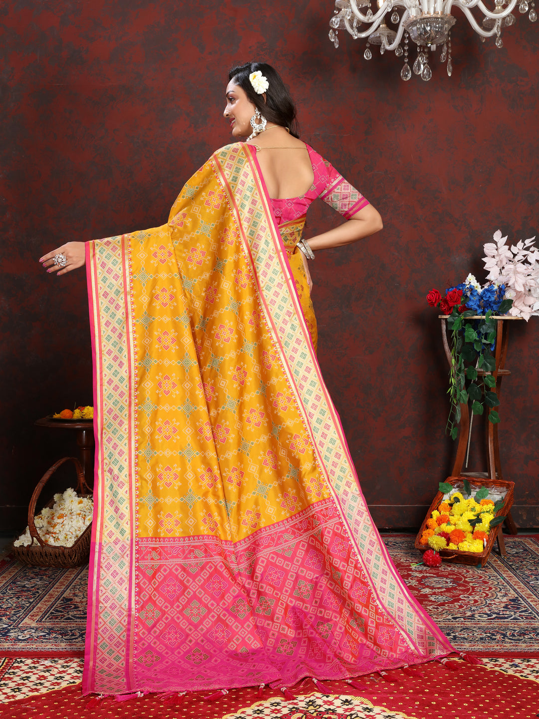 Stunning Yellow Patola Silk Saree featuring intricate meenakari work and a unique pallu for special occasions.