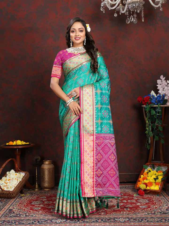 Gorgeous Sea-Green Patola Silk Saree with intricate meenakari work and dreamy pallu style for weddings.