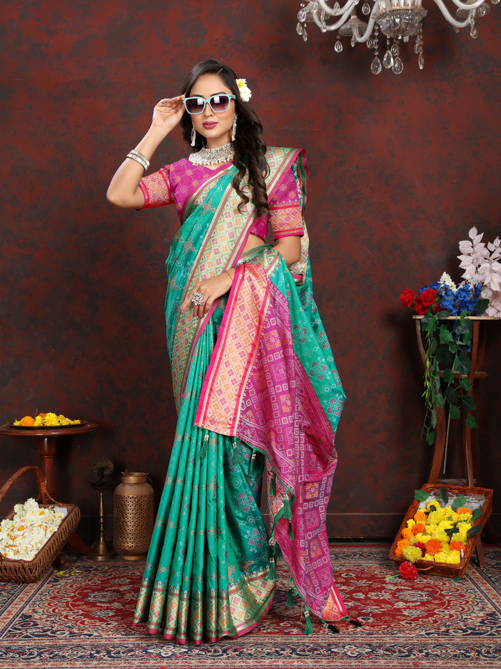 Stunning Sea-Green Patola Silk Saree with detailed meenakari design and stylish pallu style for festive celebrations.