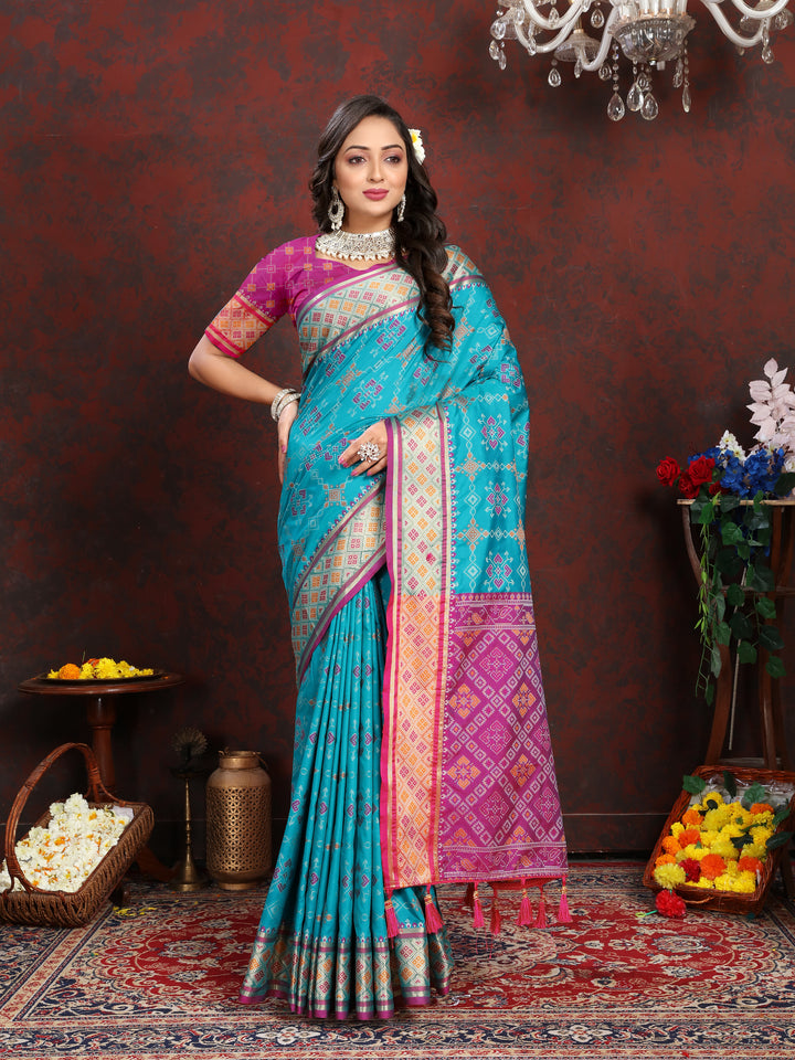 Soft Sea-Green Patola Silk Saree with dazzling meenakari work and a stylish pallu design for special occasions.