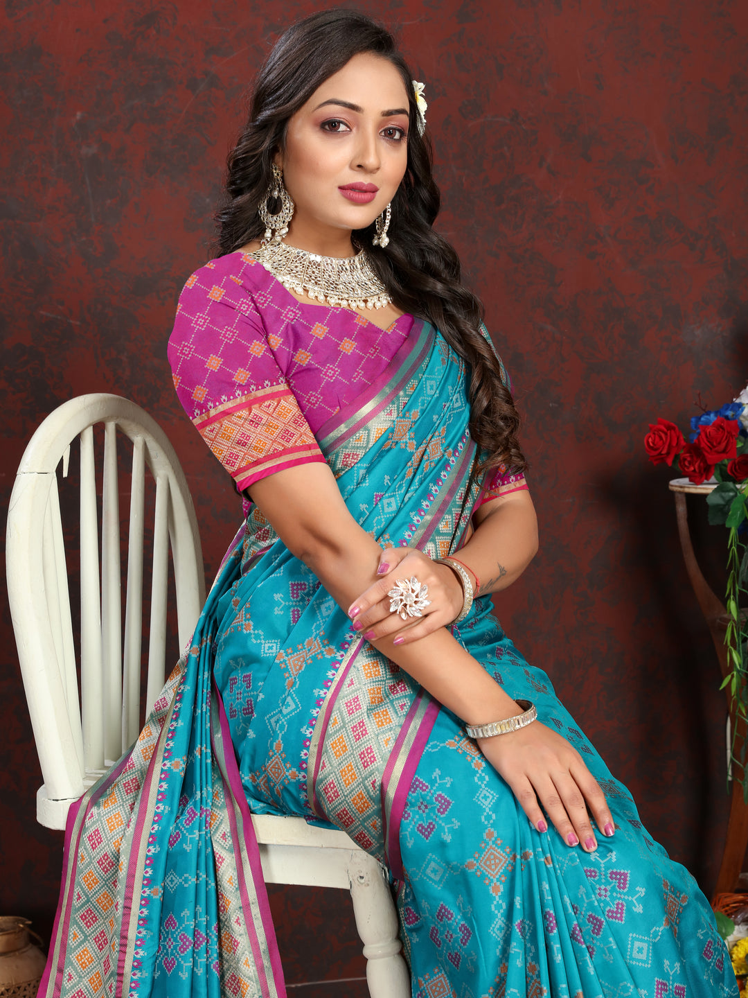 Gorgeous Sea-Blue Patola Silk Saree with intricate meenakari details and dreamy pallu style for bridal wear.