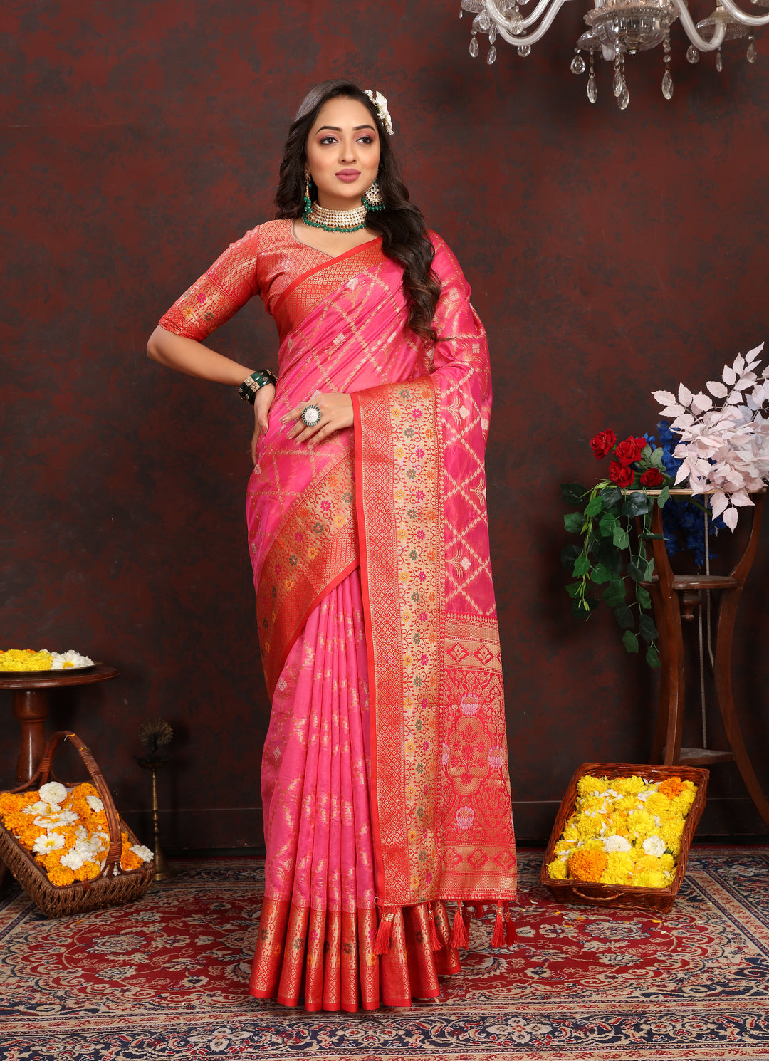 Bright pink Designer Organza silk sari with rich detail, perfect for elegant Indian ceremonies.