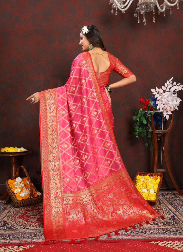 Designer bright pink Organza sari with rich embroidery and matching blouse, perfect for special occasions.