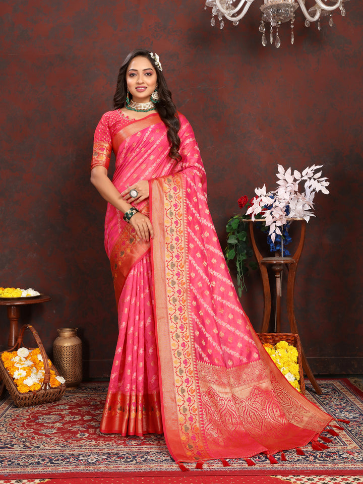 Timeless red soft organza saree with graceful detailing and matching blouse piece, ideal for weddings and celebrations.