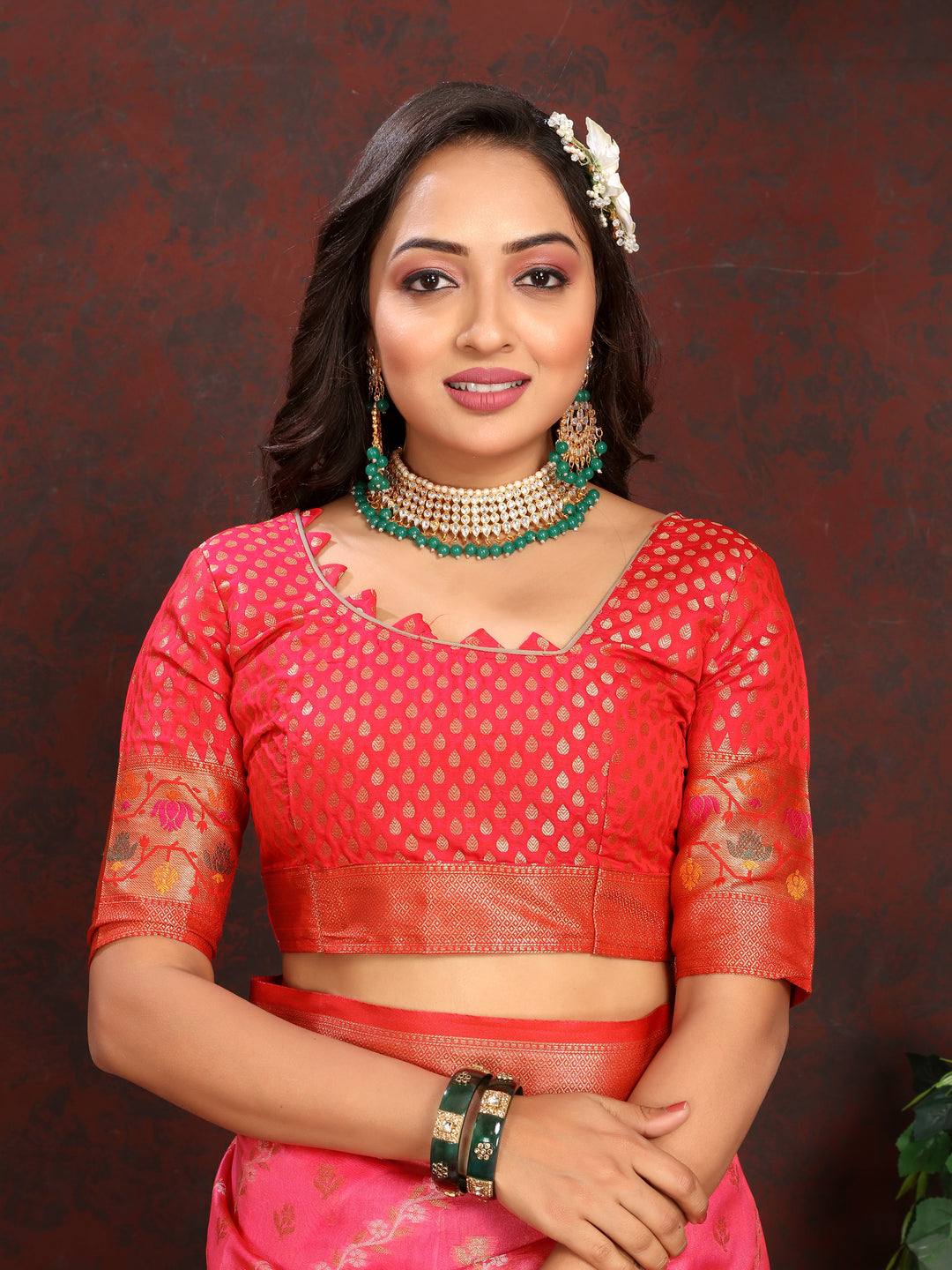 Gorgeous red organza saree with an elegant finish and a matching blouse piece, perfect for traditional and cultural gatherings.