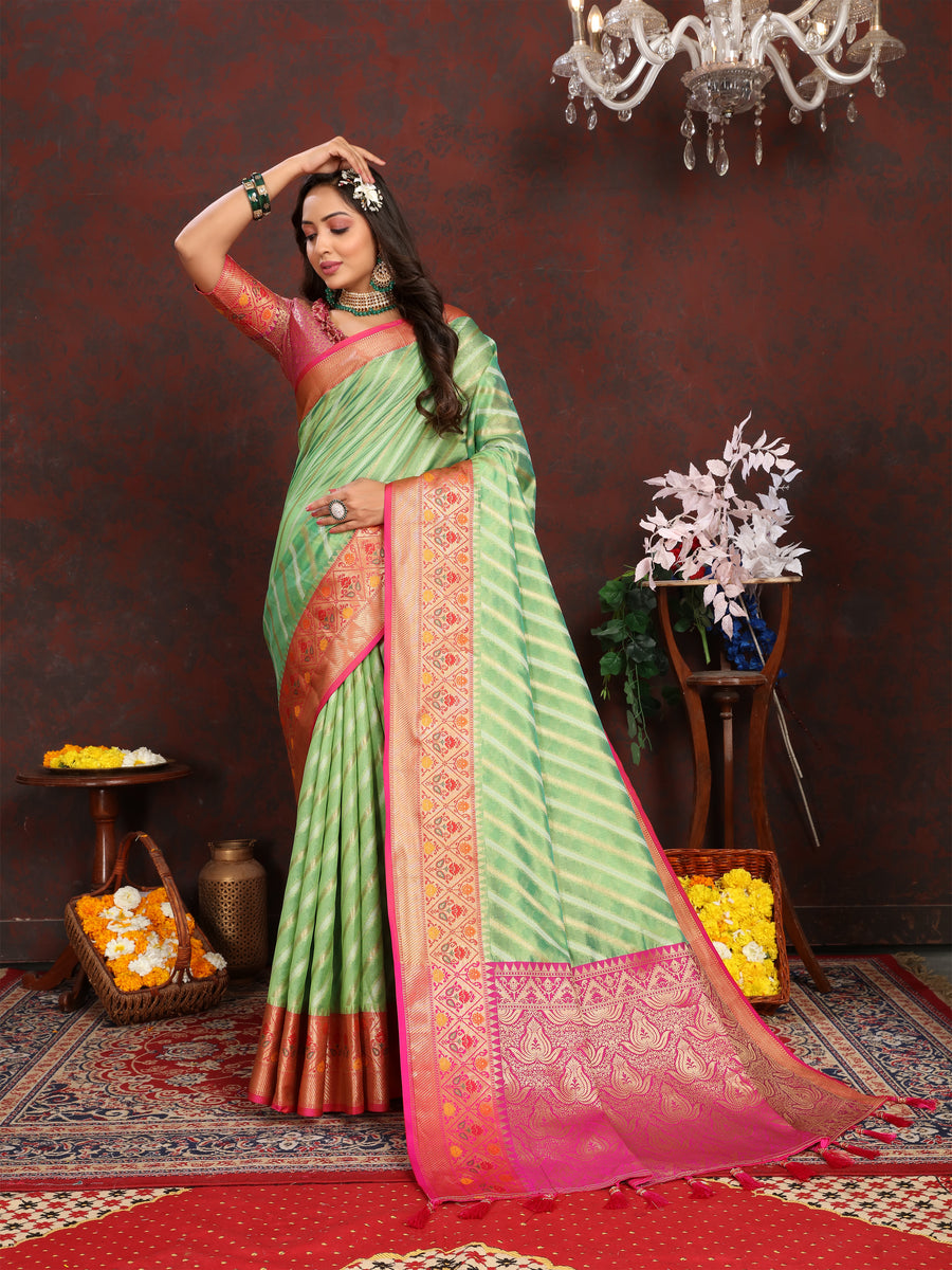 Elegant Pista-Green Soft Organza Saadi with intricate detailing and traditional luxury style for festive occasions.