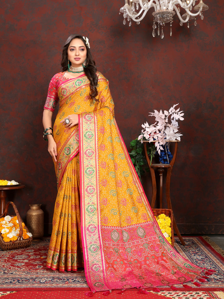 Vibrant Mustard-Yellow Soft Patola Silk Saree with intricate meenakari motifs and a stylish designer blouse.