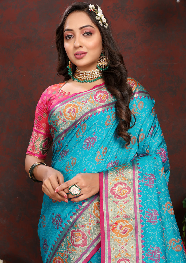 Premium Sea-Blue Patola Silk Saree with rich meenakari motifs and designer blouse for bridal wear.