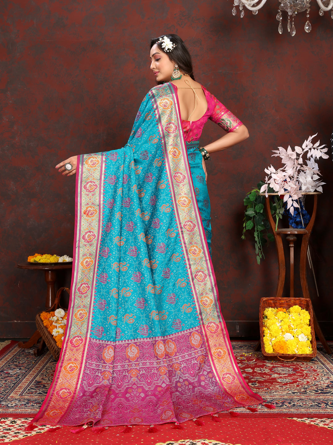 Gorgeous Sea-Blue Soft Patola Silk Saree with intricate meenakari motifs and luxurious blouse design.