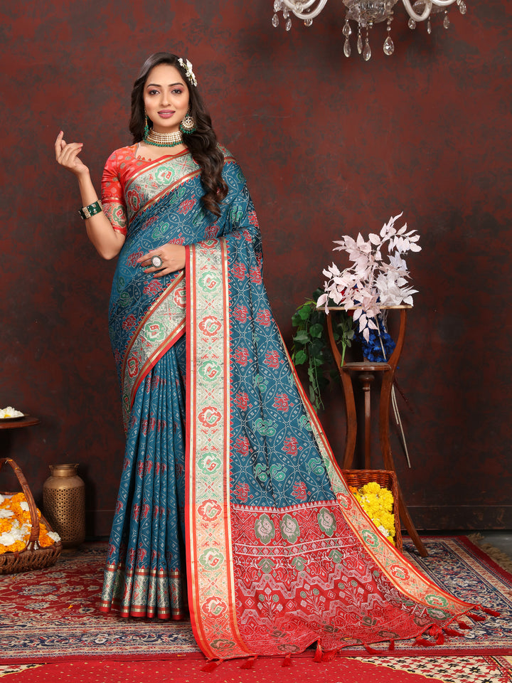 Elegant Deep-Sea-Blue Patola Silk Saree with dazzling meenakari motifs and a designer blouse for weddings.