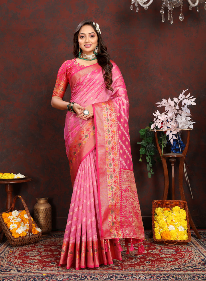 Elegant pink organza saree with exquisite embroidery and matching blouse piece, perfect for weddings and celebrations.